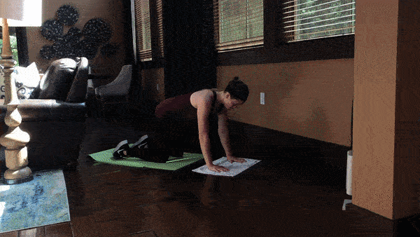 woman demonstrating kneeling plank push pull