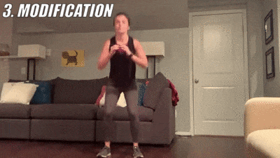 woman demonstrating modified squat jump