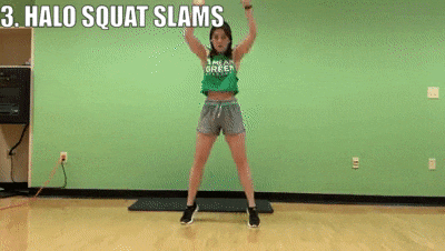 woman demonstrating halo squat slams