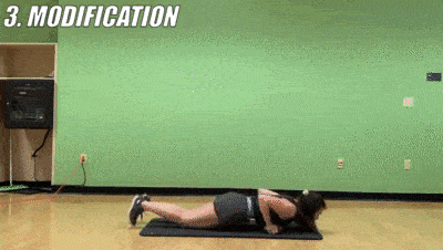 woman demonstrating modified plank row + push up 12x