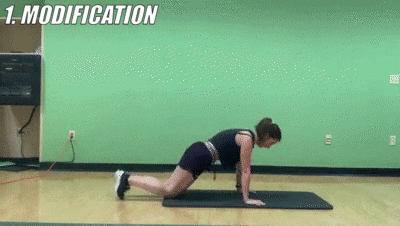 woman demonstrating modified running push up for 10-12 reps