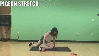 woman demonstrating pigeon stretch
