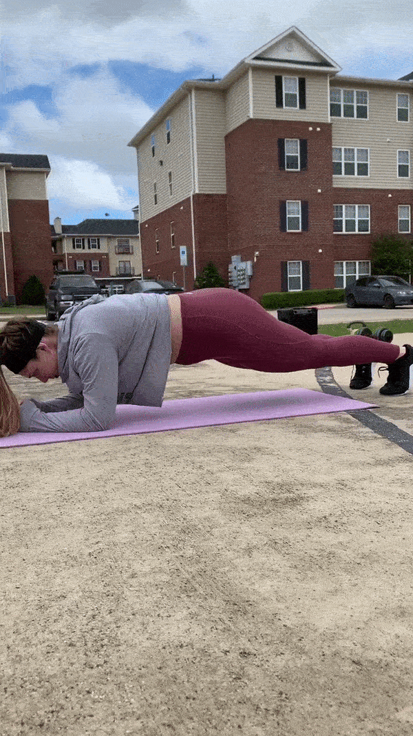 woman demonstrating low to high plank