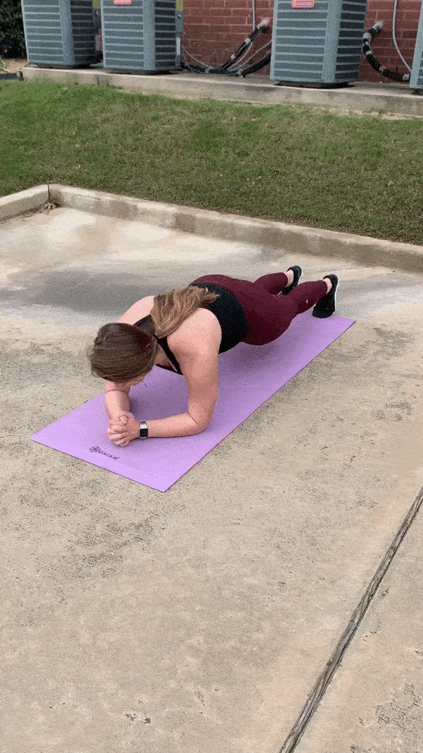 female demonstrating modified plank should tap