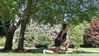 female demonstrating lunge jumps