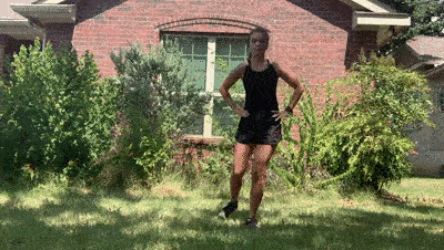 female demonstrating curtsy lunge + front kick