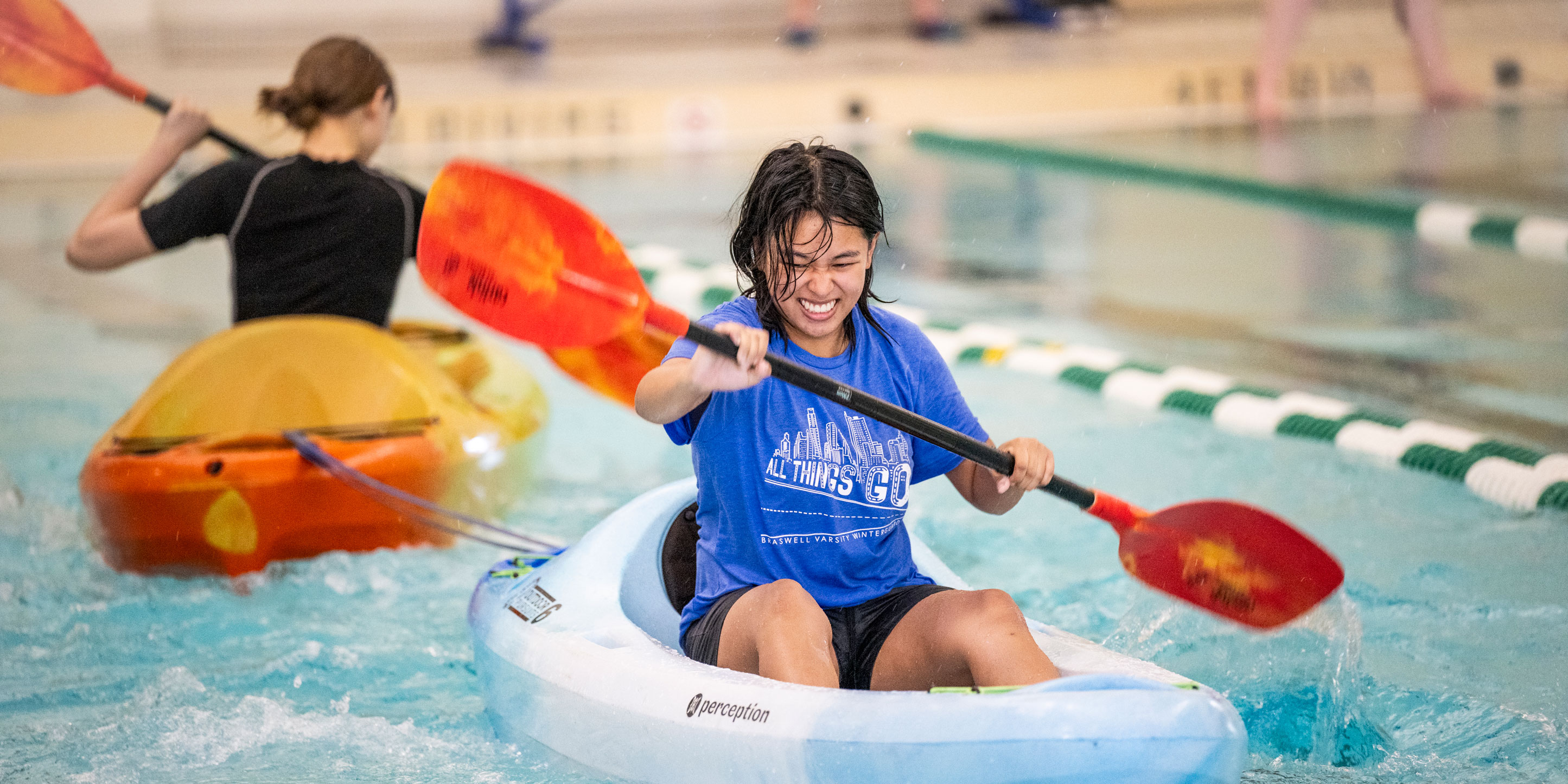 students kayaking in the pool