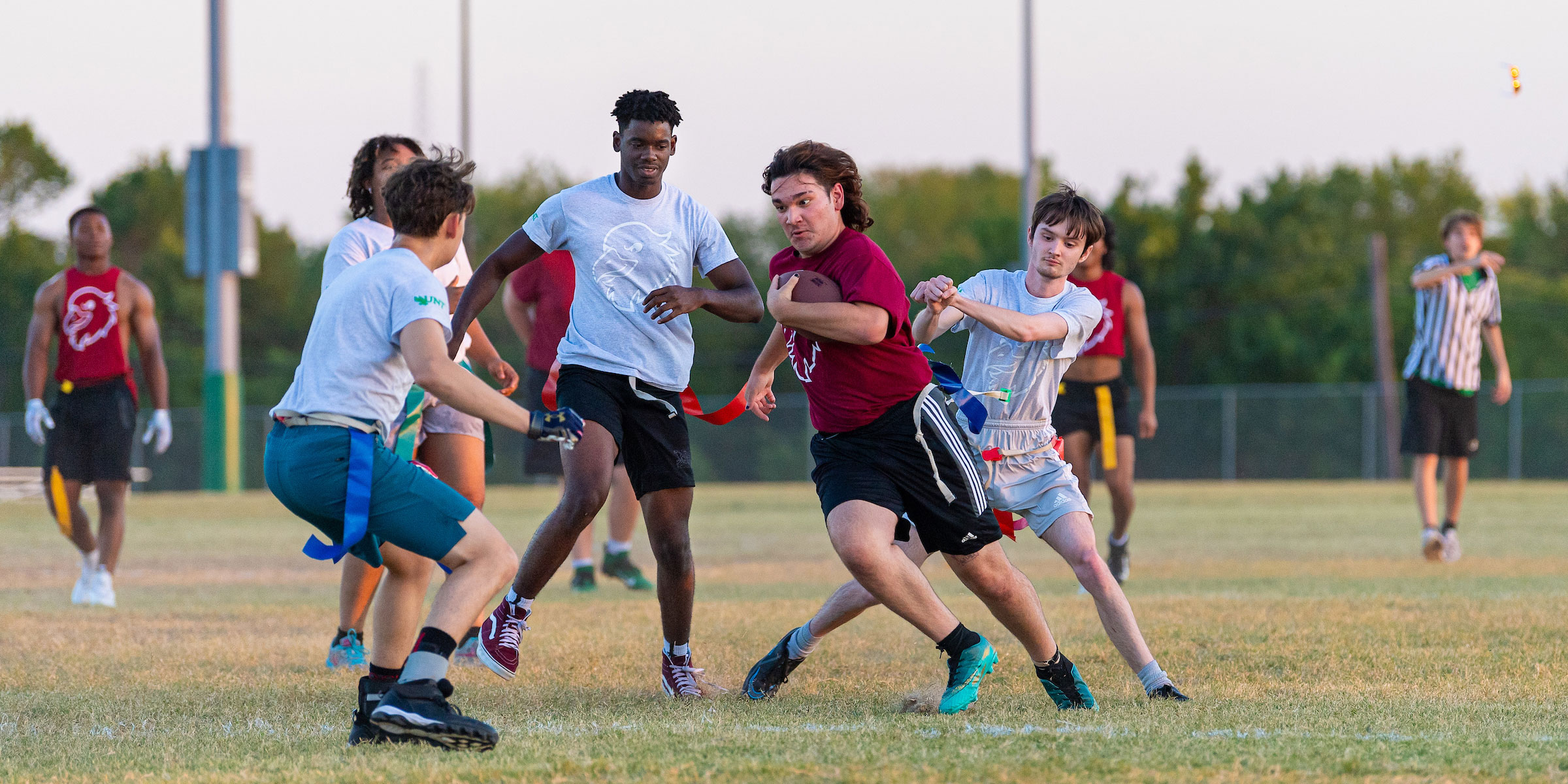 students playing tag football