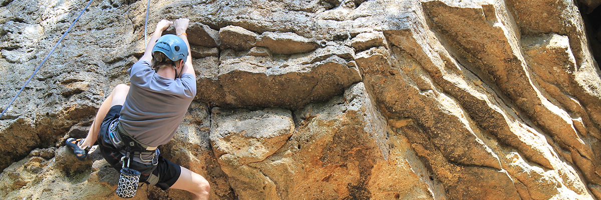 person rock climbing