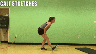 female demonstrating calf stretches