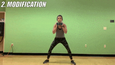 woman demonstrating modified sumo squat + pulse
