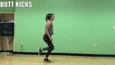 woman demonstrating Butt Kicks