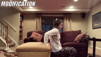 woman demonstrating modified chair dips