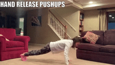 woman demonstrating hand release pushups