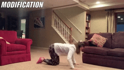 woman demonstrating modified hand release pushups