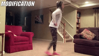 woman demonstrating modified walking lunges