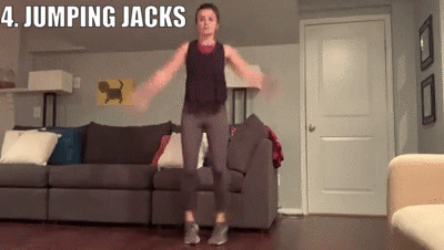 woman demonstrating jumping jacks