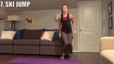 woman demonstrating ski jumps