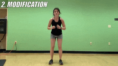 woman demonstrating modified side to side squat punch