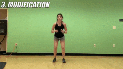 woman demonstrating modified star jumps