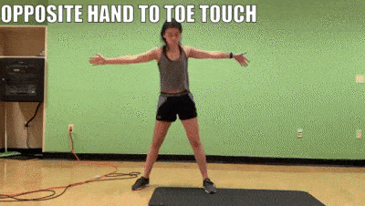 woman demonstrating opposite hand to toe touch