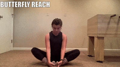 woman demonstrating butterfly reach