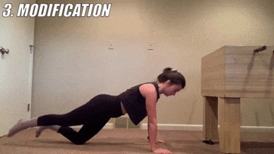 woman demonstrating modified tabletop kickback