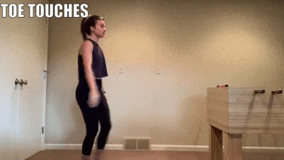 woman demonstrating toe touches