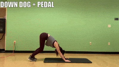 woman demonstrating down dog and pedal