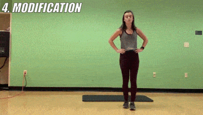 woman demonstrating modified 1 2 3 stability kick