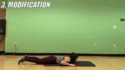 woman demonstrating modified superman burpees