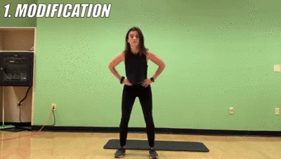 woman demonstrating modified prisoner squat pulses
