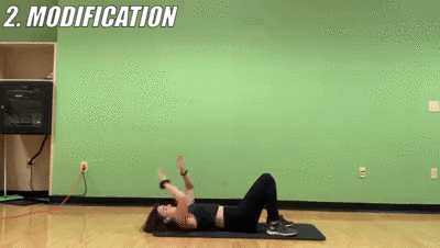 woman demonstrating modified toe touches