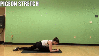 woman demonstrating pigeon stretch