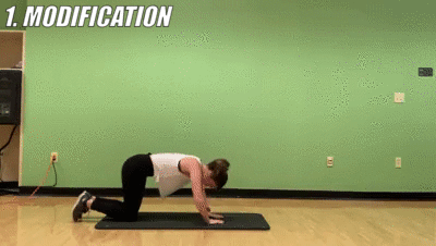 woman demonstrating modified diamond pushups