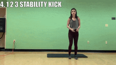 woman demonstrating 1 2 3 stability kick