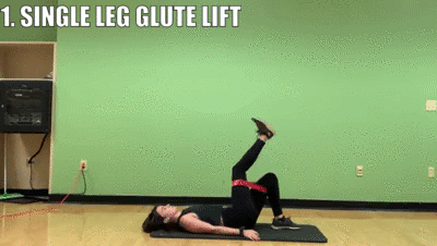 woman demonstrating single leg glute lift (right)