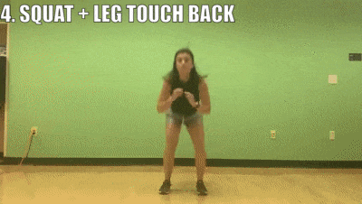 female demonstrating squat + leg touch back