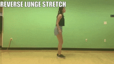 female demonstrating revenge lunge stretch