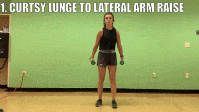 female demonstrating curtsy lunge to lateral arm raise