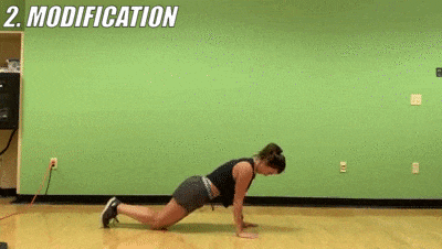 female demonstrating modified triceps push ups
