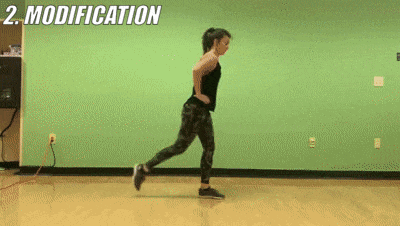 woman demonstrating modified lunge jumps