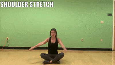 woman demonstrating shoulder stretch