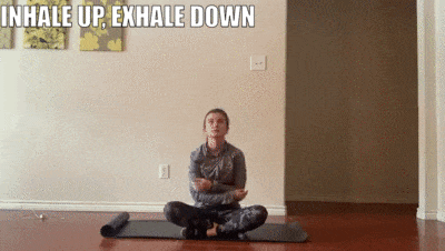 woman demonstrating inhale up exhale down