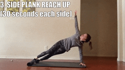 woman demonstrating side plank reach up