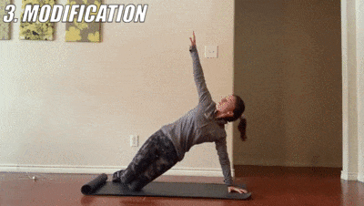 woman demonstrating modified side plank reach up