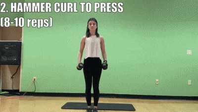 woman demonstrating hammer curl to press