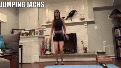 woman demonstrating jumping jacks