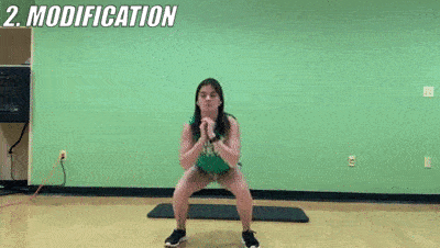 woman demonstrating modified squat + knee