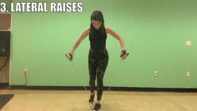 woman demonstrating lateral raises